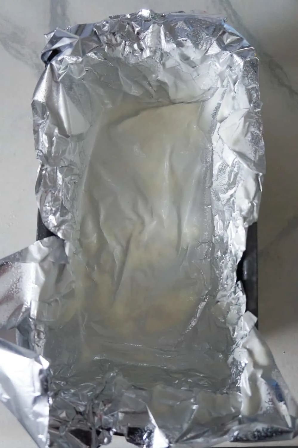 a loaf pan lined with aluminum foil