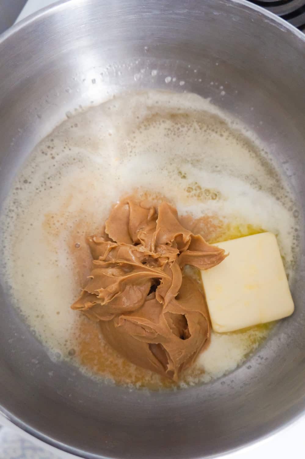 butter and peanut butter melting in a large pot