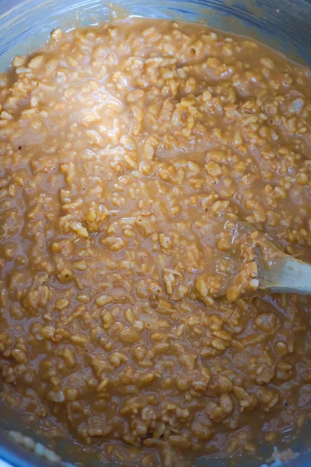 melted peanut butter and rice krispie mixture in a saucepan