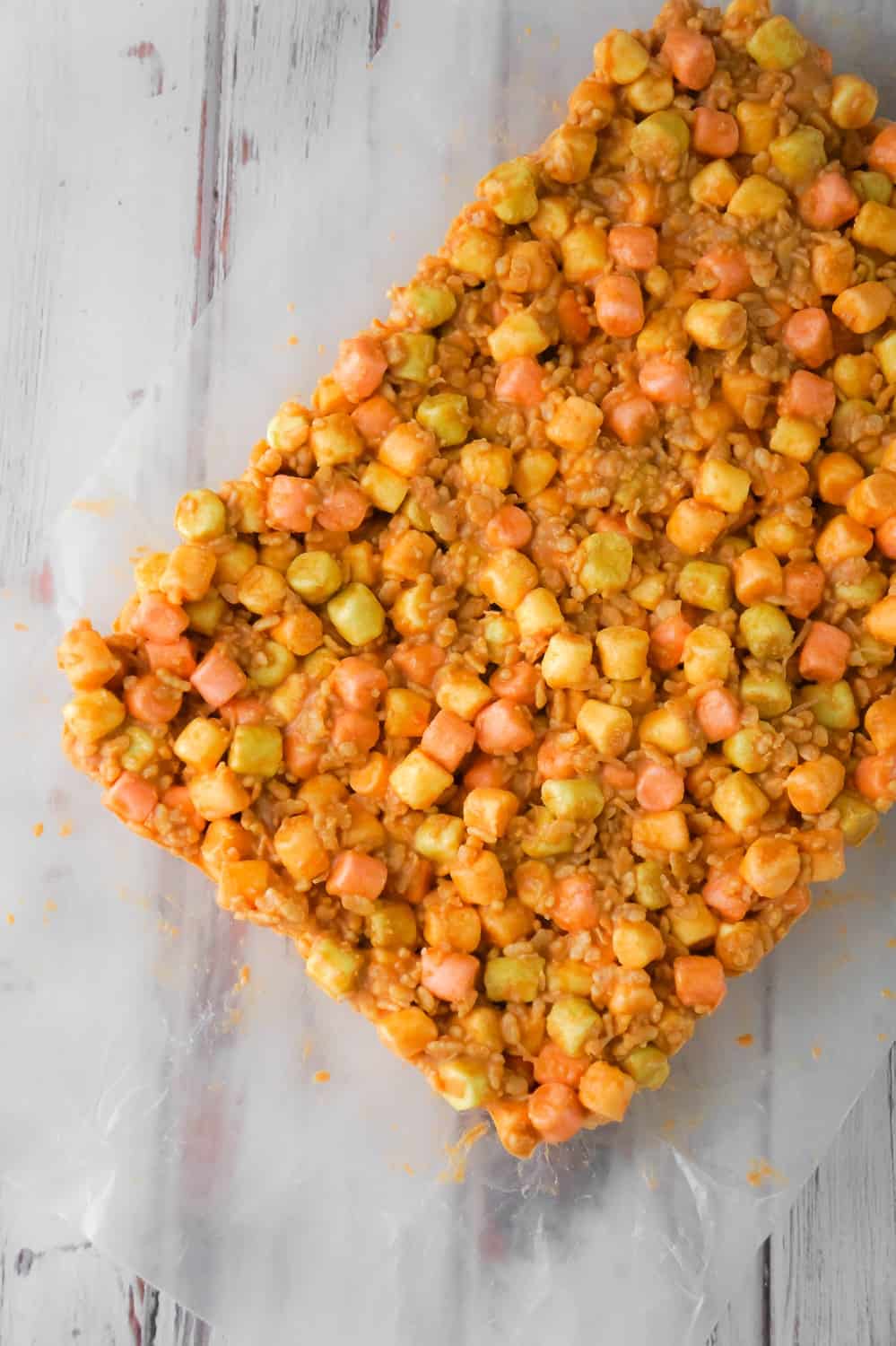 Peanut Butter Marshmallow Bars are an easy dessert recipe perfect for your holiday treat tray. These peanut butter and butterscotch confetti squares are loaded with colourful mini marshmallows, Rice Krispies and shredded coconut.