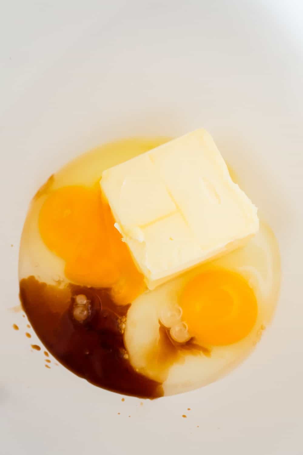 butter, eggs and vanilla extract in a mixing bowl