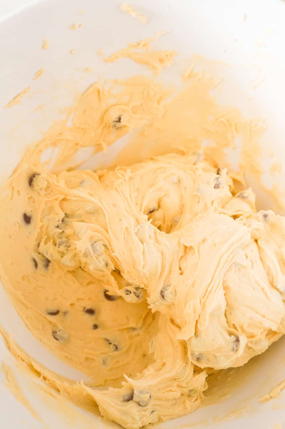 cake mix cookie dough with chocolate chips in a mixing bowl