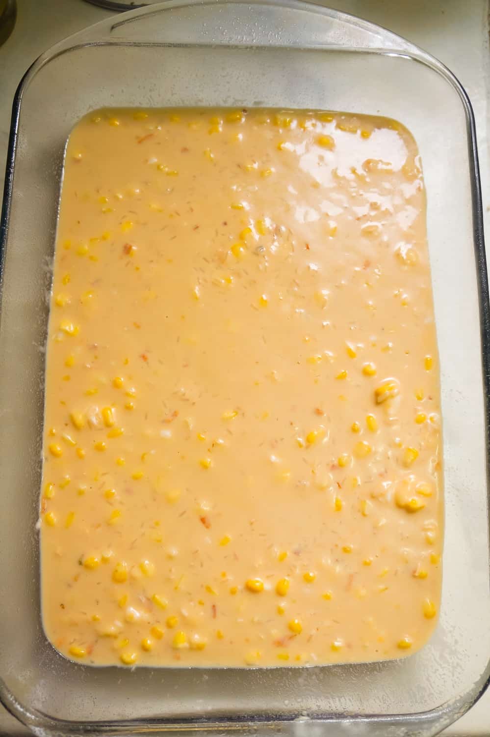 creamy rice and corn mixture in a baking dish