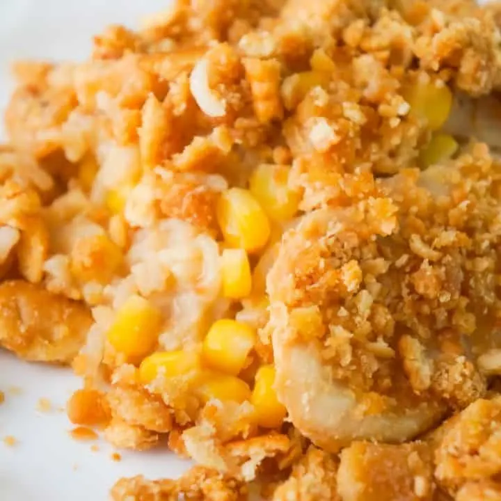 Easy Chicken and Rice Casserole is a hearty dinner recipe perfect for cold weather. This delicious chicken casserole is loaded with long grain rice, Campbell's cream of chicken soup, corn and topped with crumbled Ritz crackers.