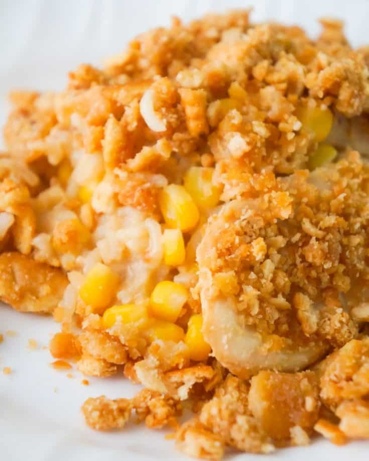 Easy Chicken and Rice Casserole is a hearty dinner recipe perfect for cold weather. This delicious chicken casserole is loaded with long grain rice, Campbell's cream of chicken soup, corn and topped with crumbled Ritz crackers.