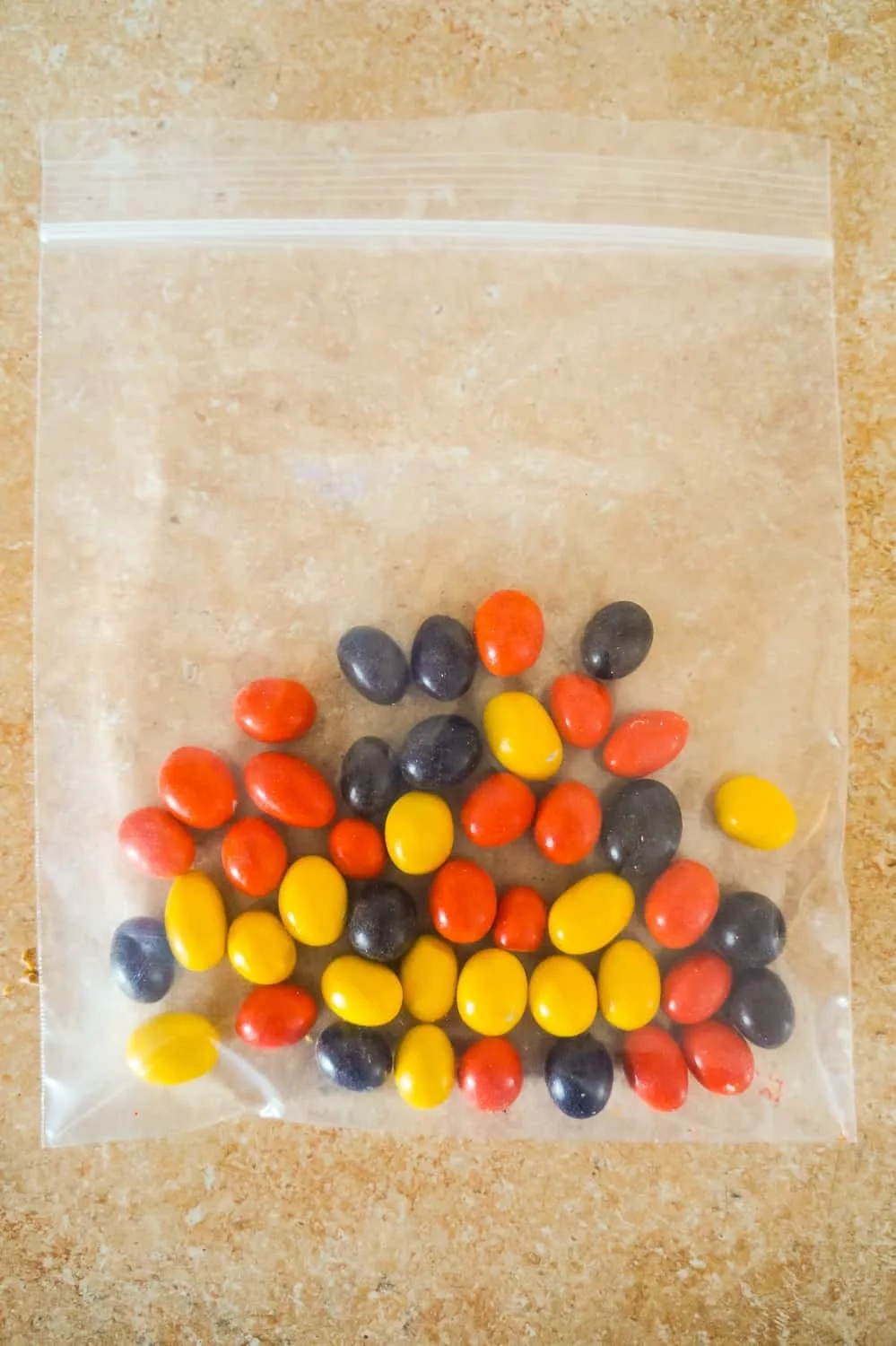 Reese's Pieces Peanut candies in a Ziploc bag