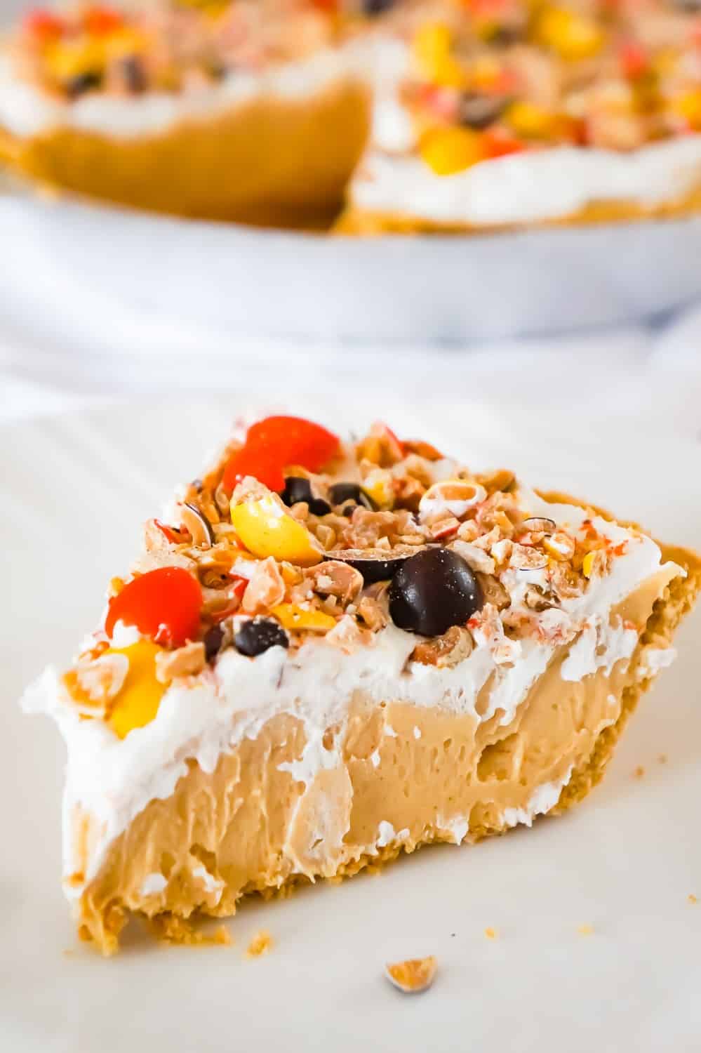 Peanut Butter Pie is an easy no bake dessert for peanut butter lovers. This no bake pie has a rich and creamy peanut butter filling, in a store bought graham crust and is topped with Cool Whip and Reese's Pieces Peanut candies.