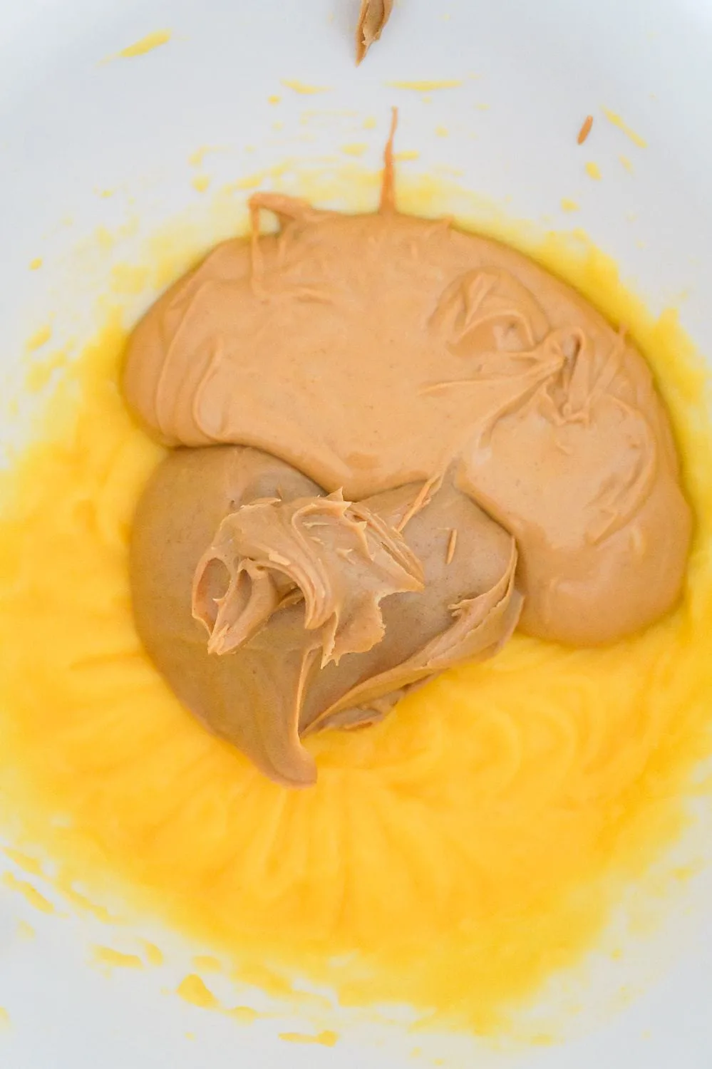 vanilla pudding mixture, smooth peanut butter and melted peanut butter chips in a mixing bowl.
