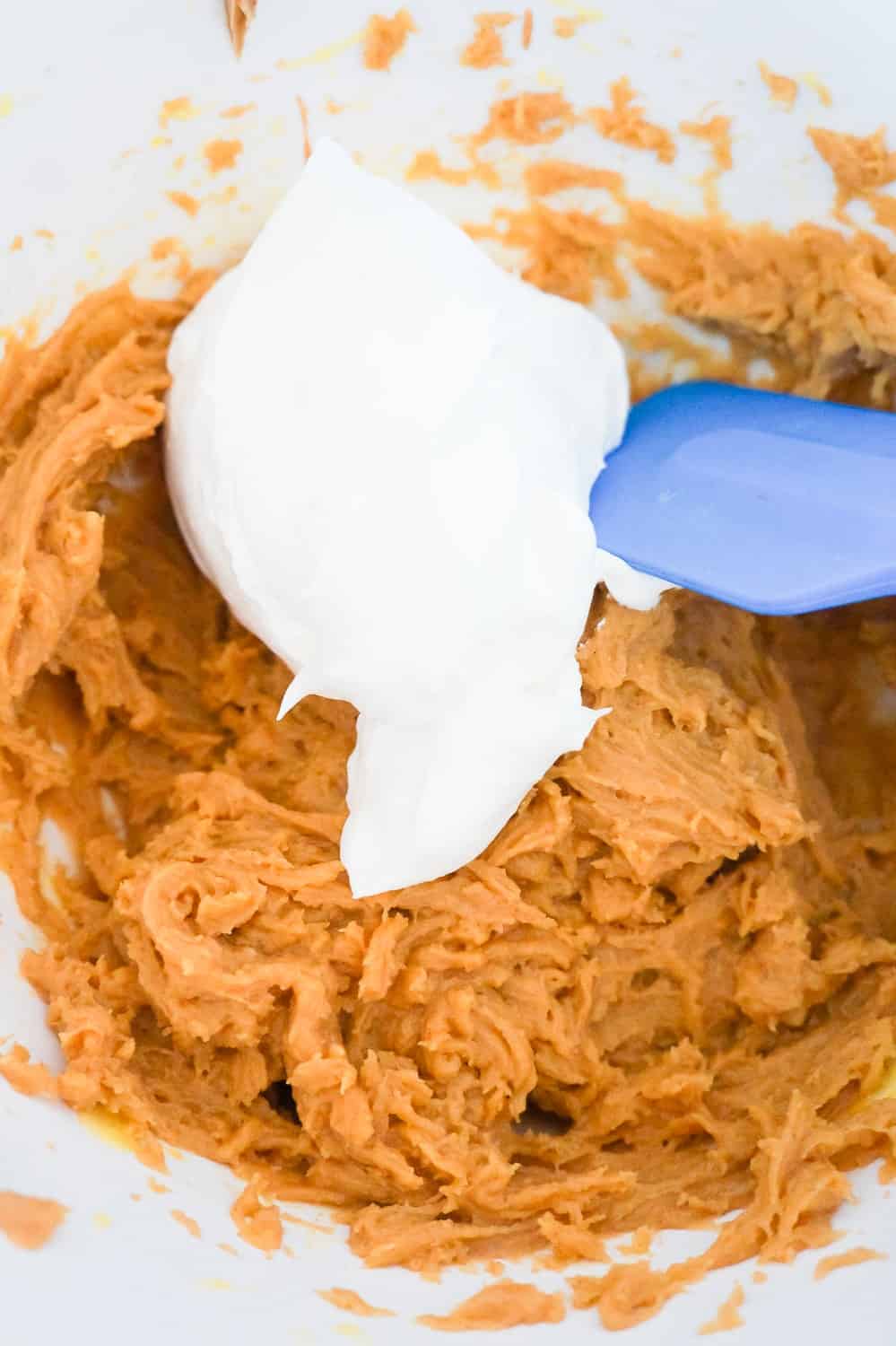 peanut butter mixture and Cool Whip in a mixing bowl