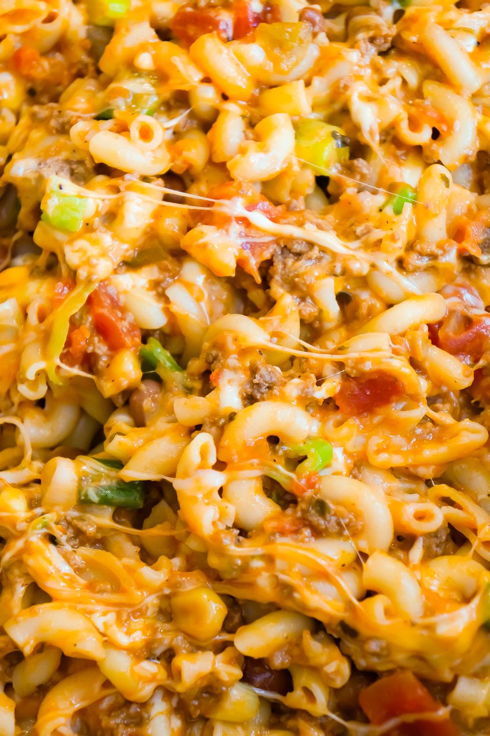 Taco Pasta is an easy ground beef dinner recipe that is fun and kid friendly. This cheesy macaroni tossed in salsa and taco sauce is baked in Old El Paso Tortilla Bowls.