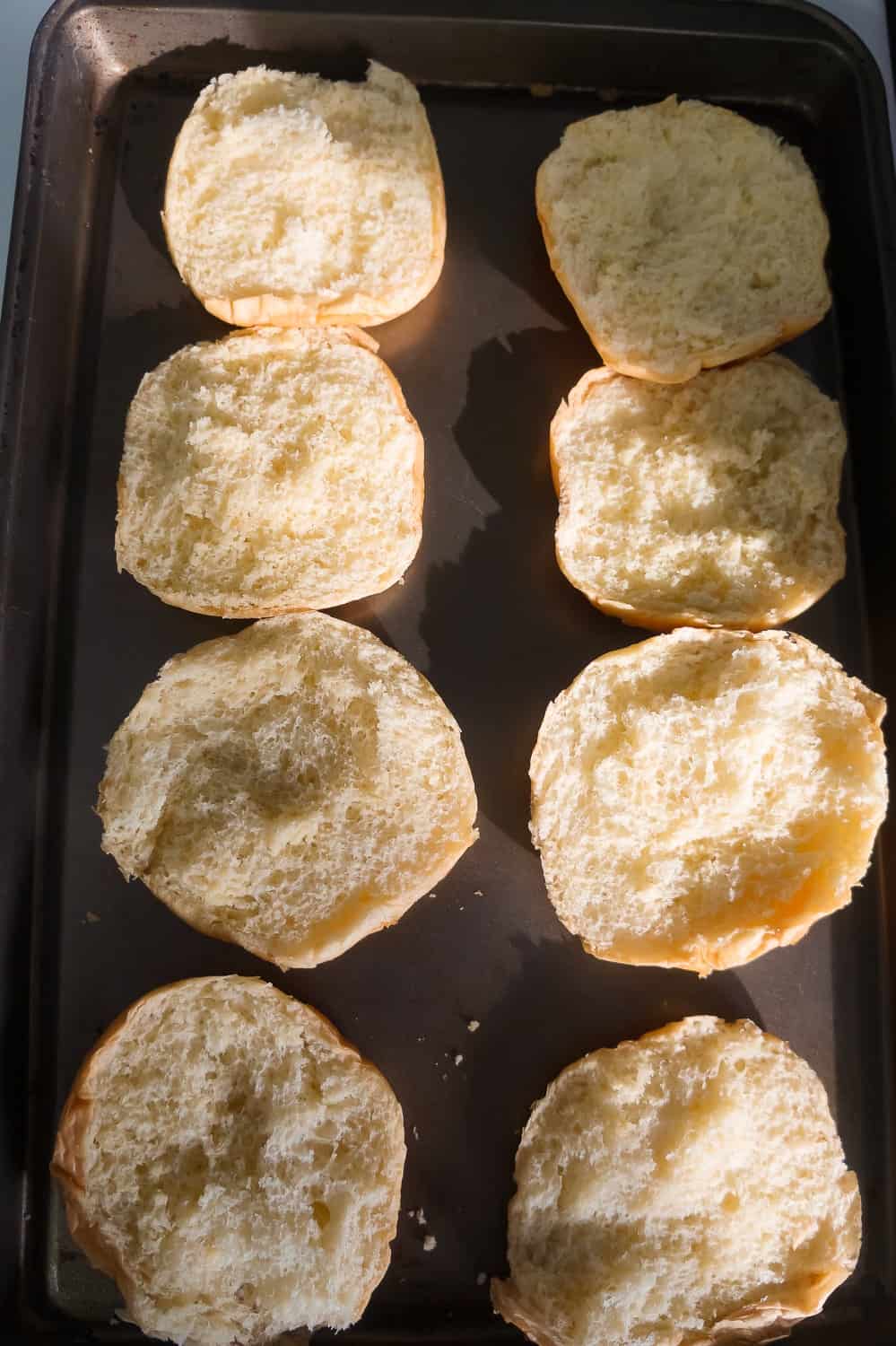 brioche buns on a baking sheet