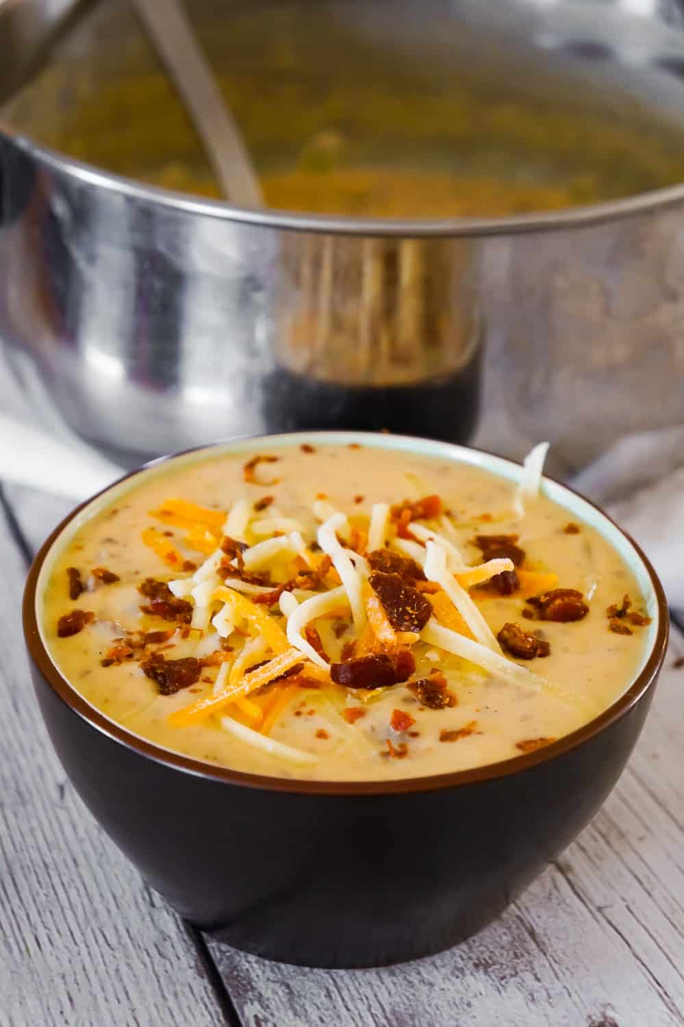 Bacon Cheeseburger Soup is a hearty soup recipe that can be whipped up in just fifteen minutes. This tasty dish made with Campbell's Cream of Bacon soup and Campbell's Cheddar Cheese soup, is loaded with ground beef, real bacon bits and cheddar cheese.