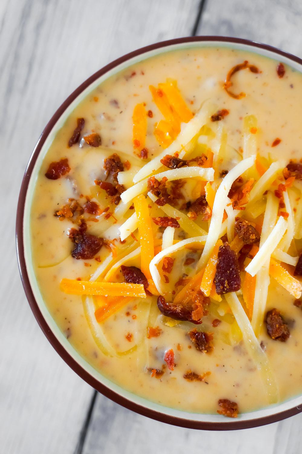 Bacon Cheeseburger Soup is a hearty soup recipe that can be whipped up in just fifteen minutes. This tasty dish made with Campbell's Cream of Bacon soup and Campbell's Cheddar Cheese soup, is loaded with ground beef, real bacon bits and cheddar cheese.
