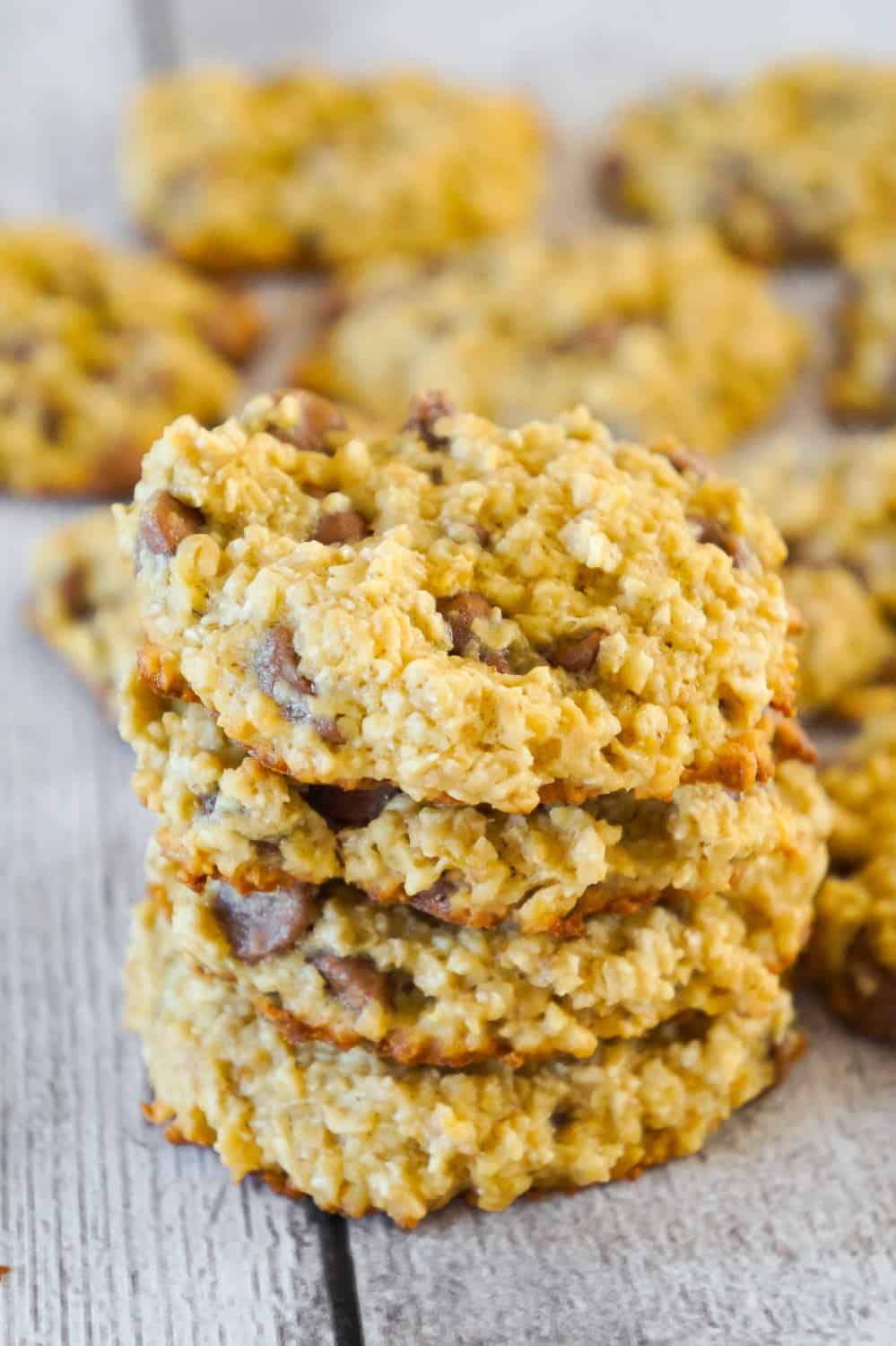 Banana Oatmeal Cookies are an easy flourless cookie recipe. These chewy oatmeal cookies are loaded with milk chocolate chips.