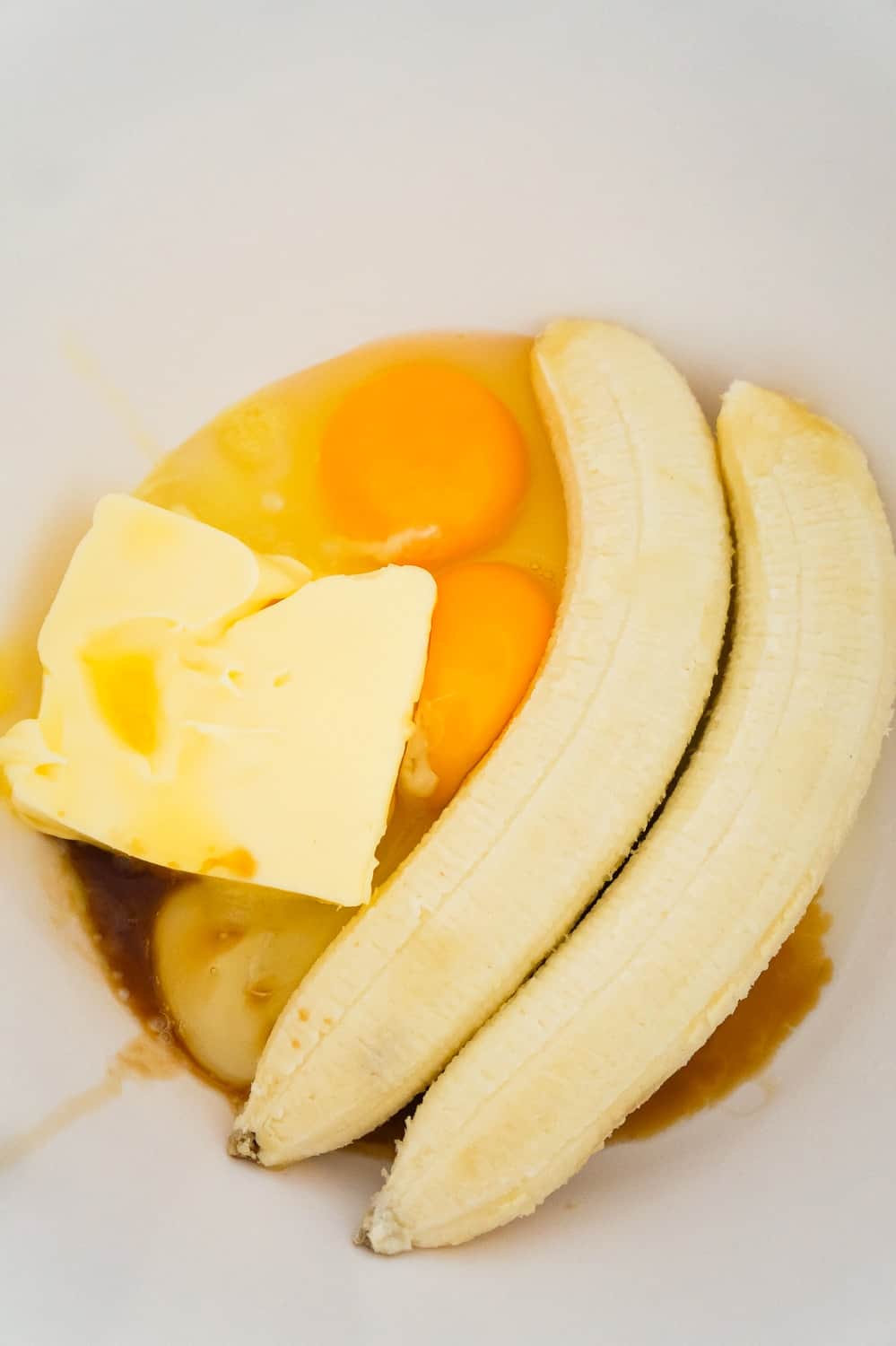 ripe bananas, eggs and softened butter in a mixing bowl