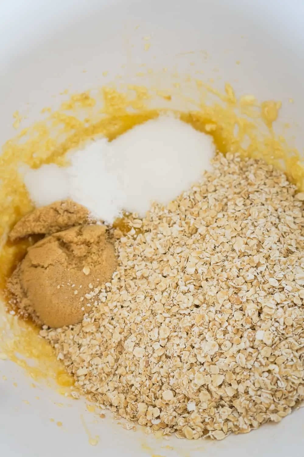quick oats, brown sugar and granulated sugar in a mixing bowl