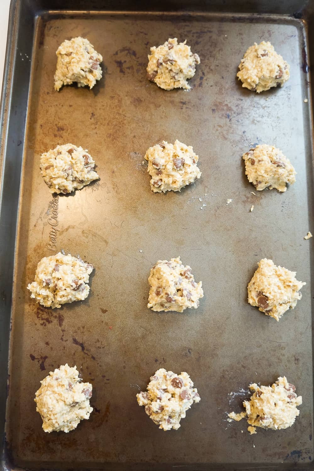 banana oatmeal cookie dough balls on a baking sheet