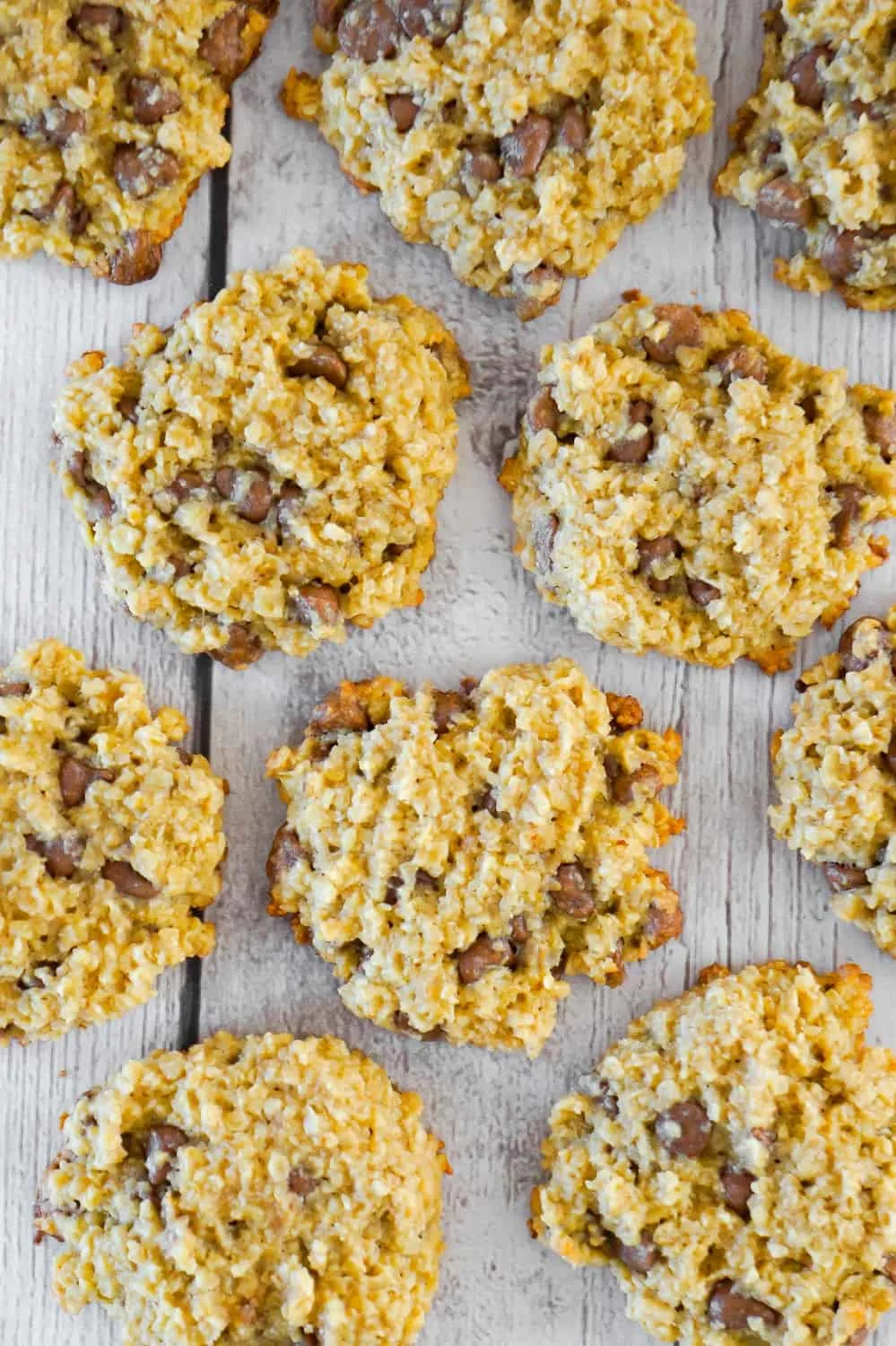 Banana Oatmeal Cookies are an easy flourless cookie recipe. These chewy oatmeal cookies are loaded with milk chocolate chips.