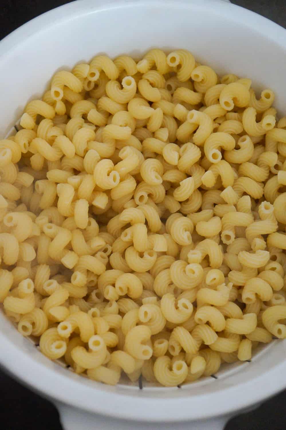 cooked cavatappi pasta in a strainer