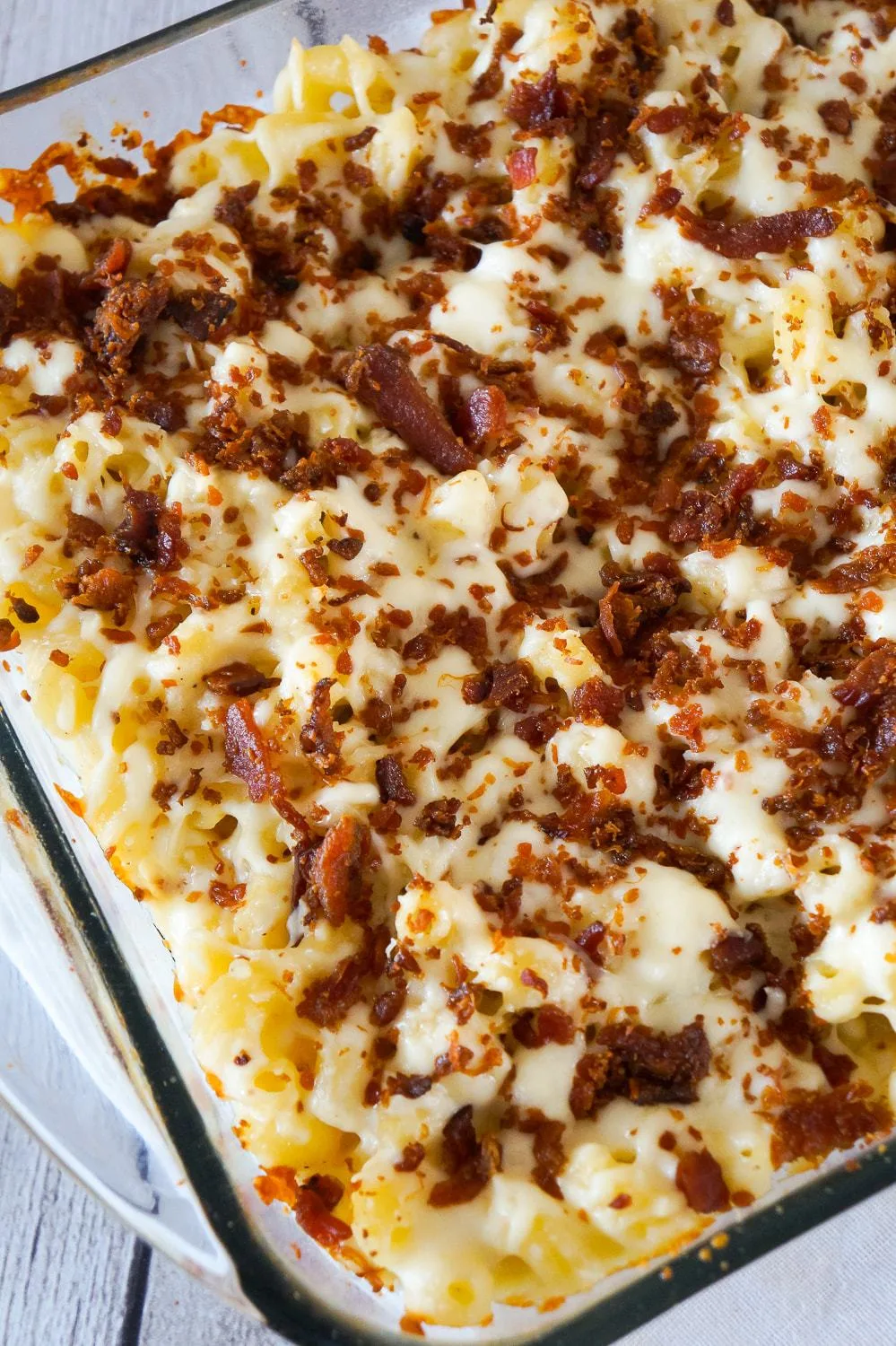 Cheesy Bacon Cavatappi Pasta is an easy and flavourful baked pasta recipe using Campbell's cream of bacon soup. This creamy pasta is loaded with Parmesan cheese, mozzarella cheese and crispy bacon.