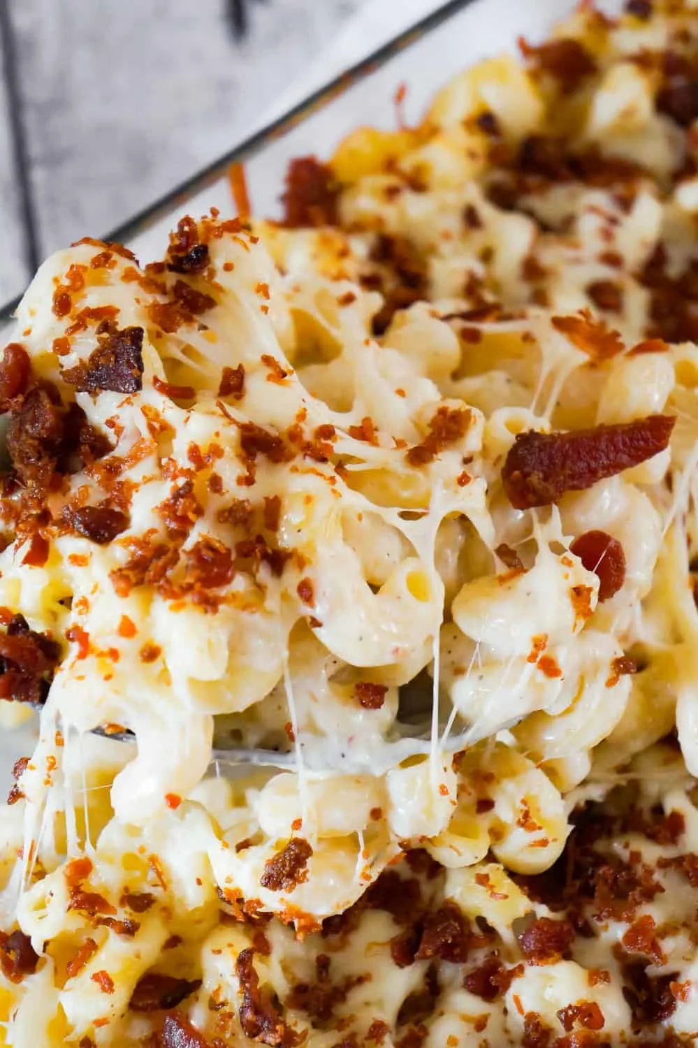 Cheesy Bacon Cavatappi Pasta is an easy and flavourful baked pasta recipe using Campbell's cream of bacon soup. This creamy pasta is loaded with Parmesan cheese, mozzarella cheese and crispy bacon.