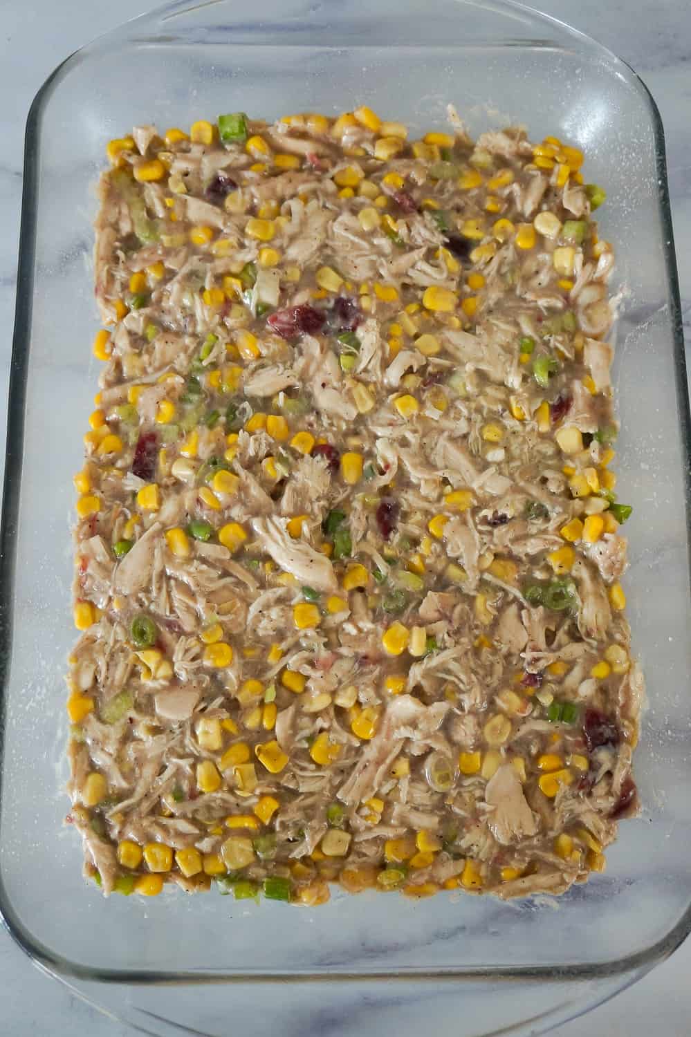 creamy chicken mixture in the bottom of a 9 x 13 inch baking dish