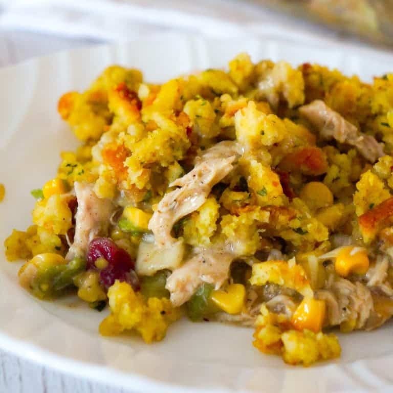 Chicken Casserole with Stuffing is an easy chicken dinner recipe perfect for weeknights. This hearty chicken casserole is loaded with shredded rotisserie chicken, corn, green onions and cranberry sauce and topped with stove top stuffing.