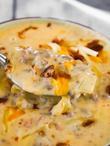 Bacon Cheeseburger Soup is a hearty soup recipe that can be whipped up in just fifteen minutes. This tasty dish made with Campbell's Cream of Bacon soup and Campbell's Cheddar Cheese soup, is loaded with ground beef, real bacon bits and cheddar cheese.