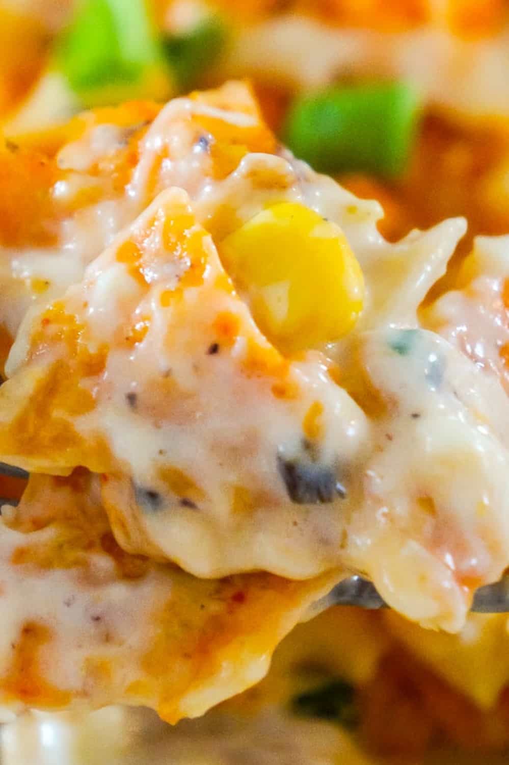 Doritos Casserole with Chicken is an easy weeknight dinner recipe using rotisserie chicken. This creamy chicken casserole is loaded with cream cheese, corn, shredded cheddar and topped with crumbled Doritos.