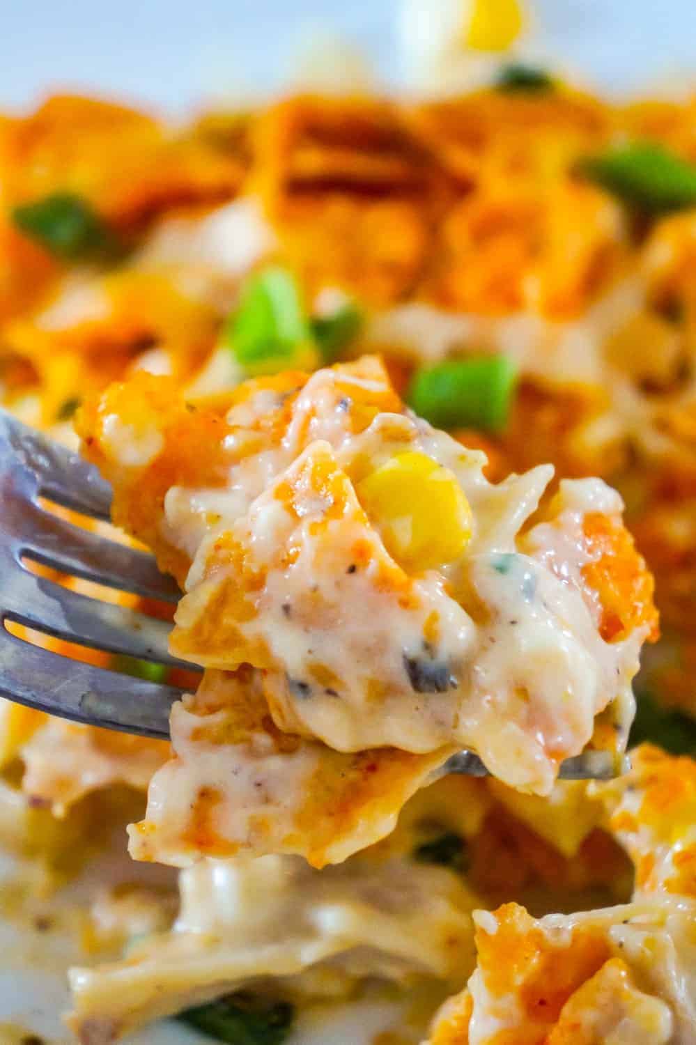 Doritos Casserole with Chicken is an easy weeknight dinner recipe using rotisserie chicken. This creamy chicken casserole is loaded with cream cheese, corn, shredded cheddar and topped with crumbled Doritos.