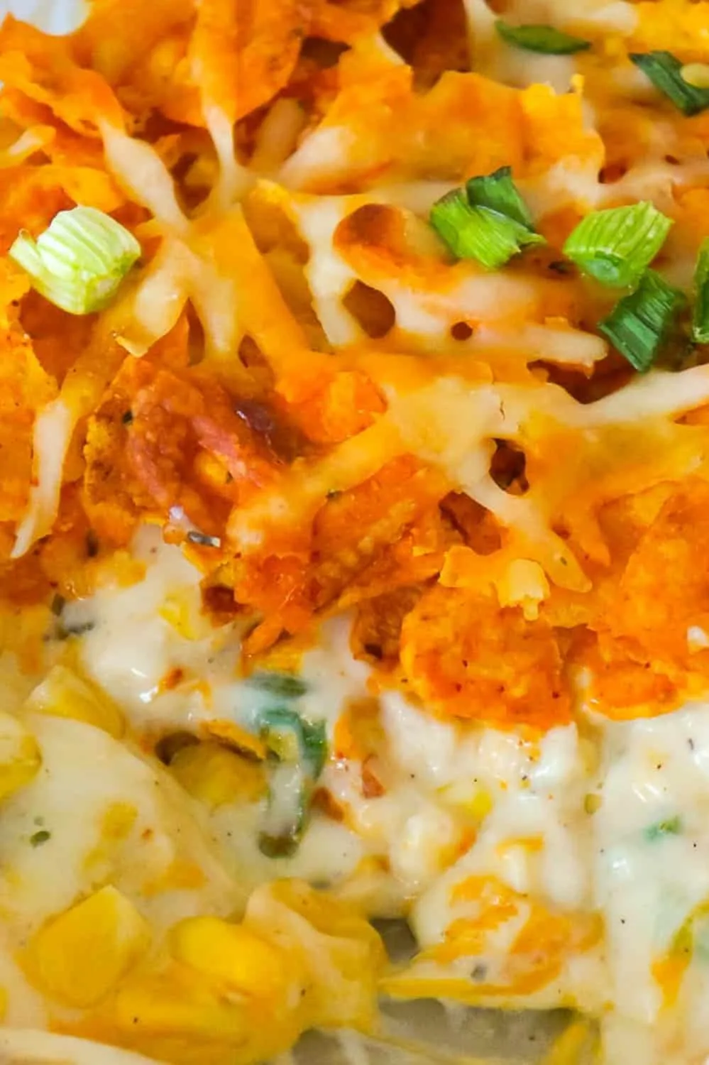 Doritos Casserole with Chicken is an easy weeknight dinner recipe using rotisserie chicken. This creamy chicken casserole is loaded with cream cheese, corn, shredded cheddar and topped with crumbled Doritos.