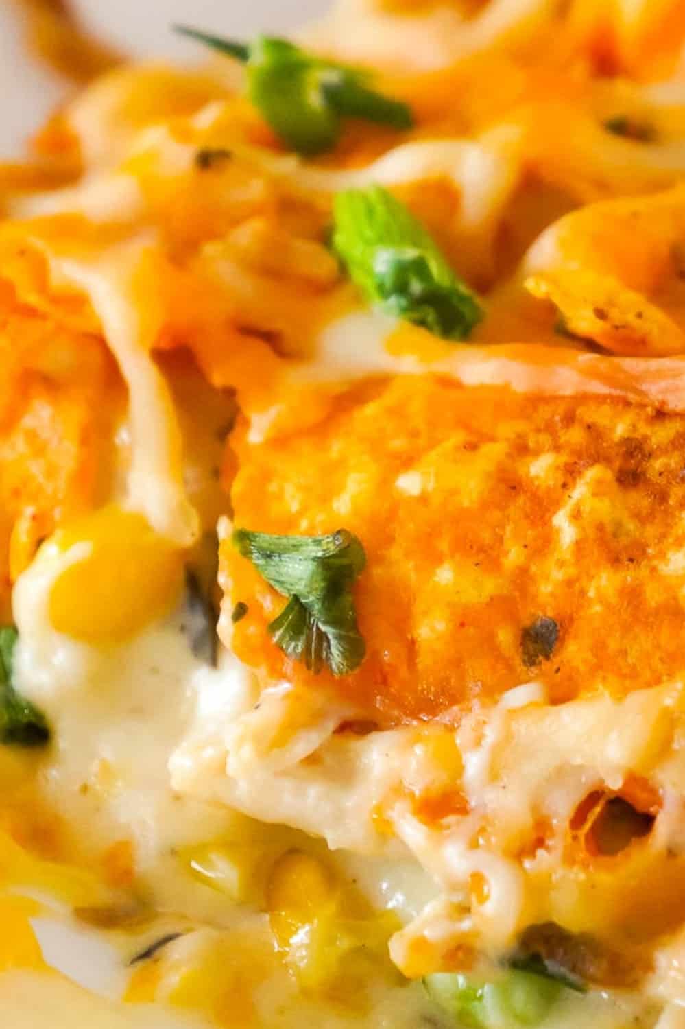 Doritos Casserole with Chicken is an easy weeknight dinner recipe using rotisserie chicken. This creamy chicken casserole is loaded with cream cheese, corn, shredded cheddar and topped with crumbled Doritos.