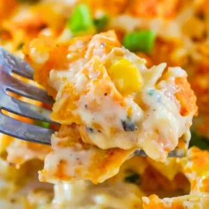 Doritos Casserole with Chicken is an easy weeknight dinner recipe using rotisserie chicken. This creamy chicken casserole is loaded with cream cheese, corn, shredded cheddar and topped with crumbled Doritos.
