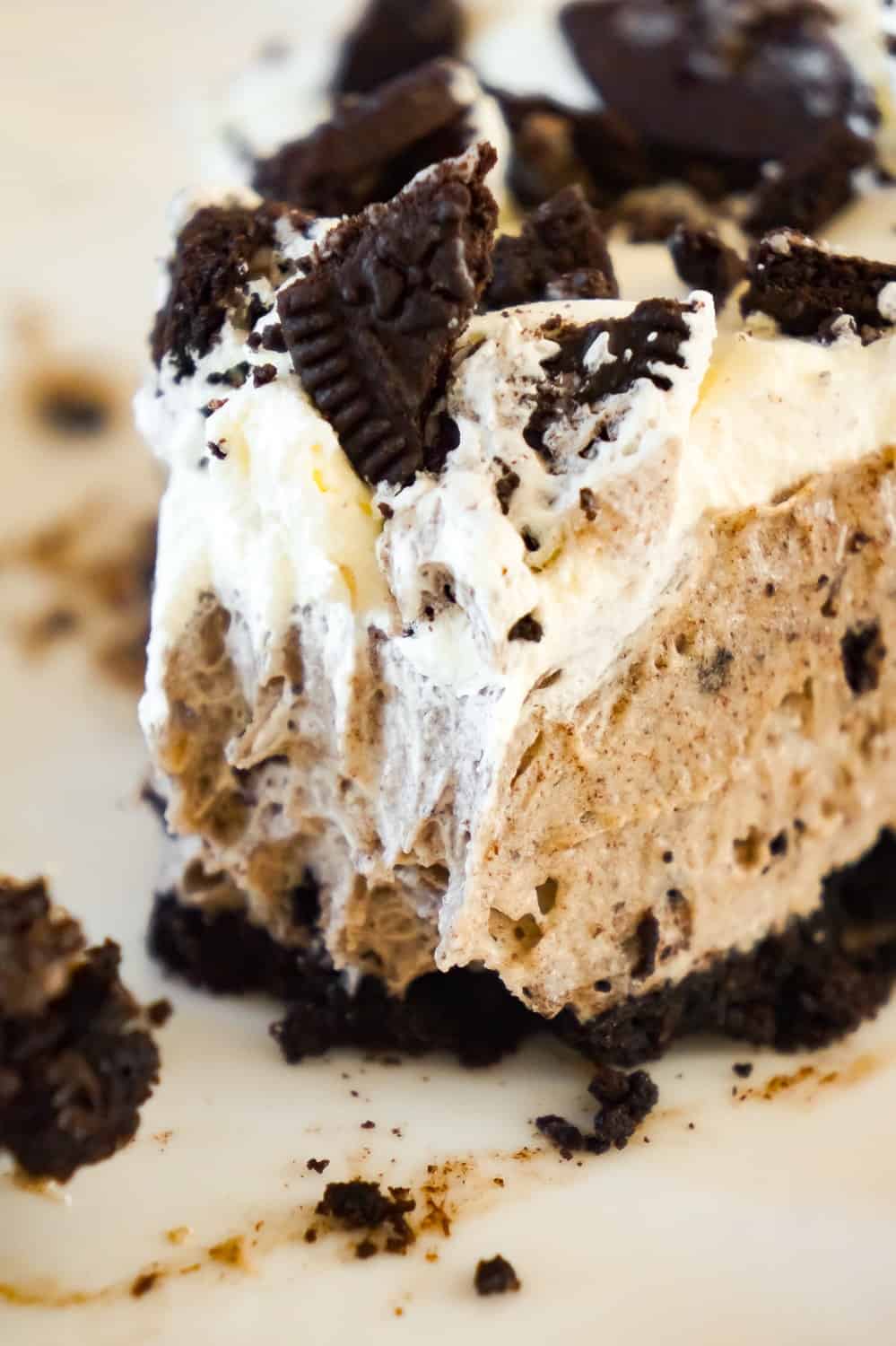 Oreo Pie is an easy no bake dessert recipe using vanilla instant pudding and a store bought Oreo crust. The creamy pudding and Cool Whip filling is loaded with white chocolate and crushed Oreo cookies.