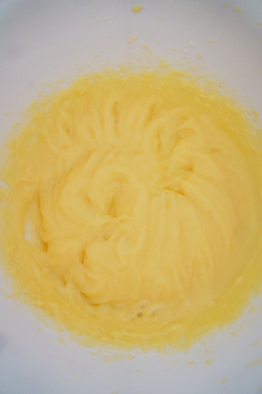 vanilla pudding mixture in a mixing bowl