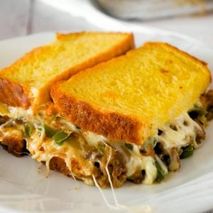 Philly Cheese Steak Grilled Cheese Casserole is a fun twist on a classic sandwich. This simple and delicious casserole is loaded with roast beef, green peppers, onions and oozing with mozzarella cheese.