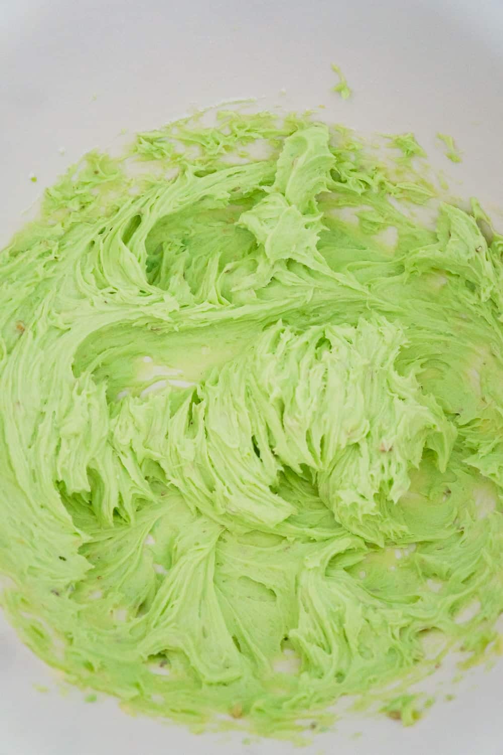 pistachio pudding mixture in a mixing bowl