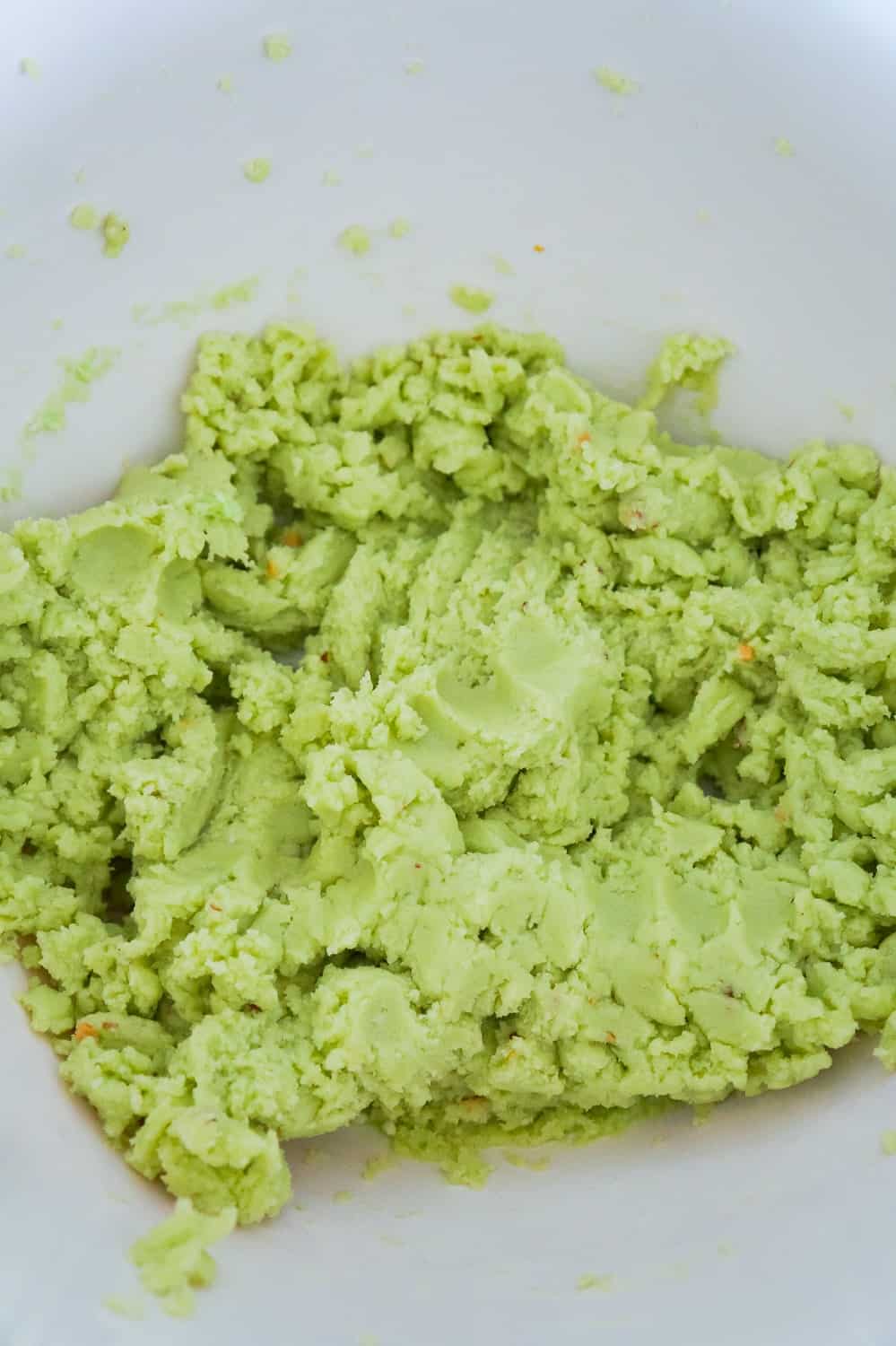 pistachio pudding sugar cookie dough in a mixing bowl