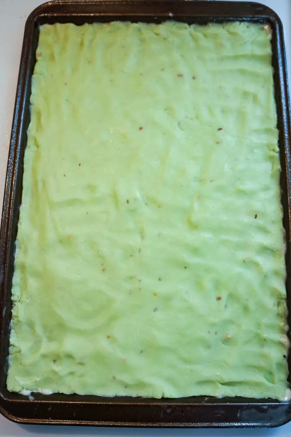 pistachio pudding sugar dough pressed out in baking sheet