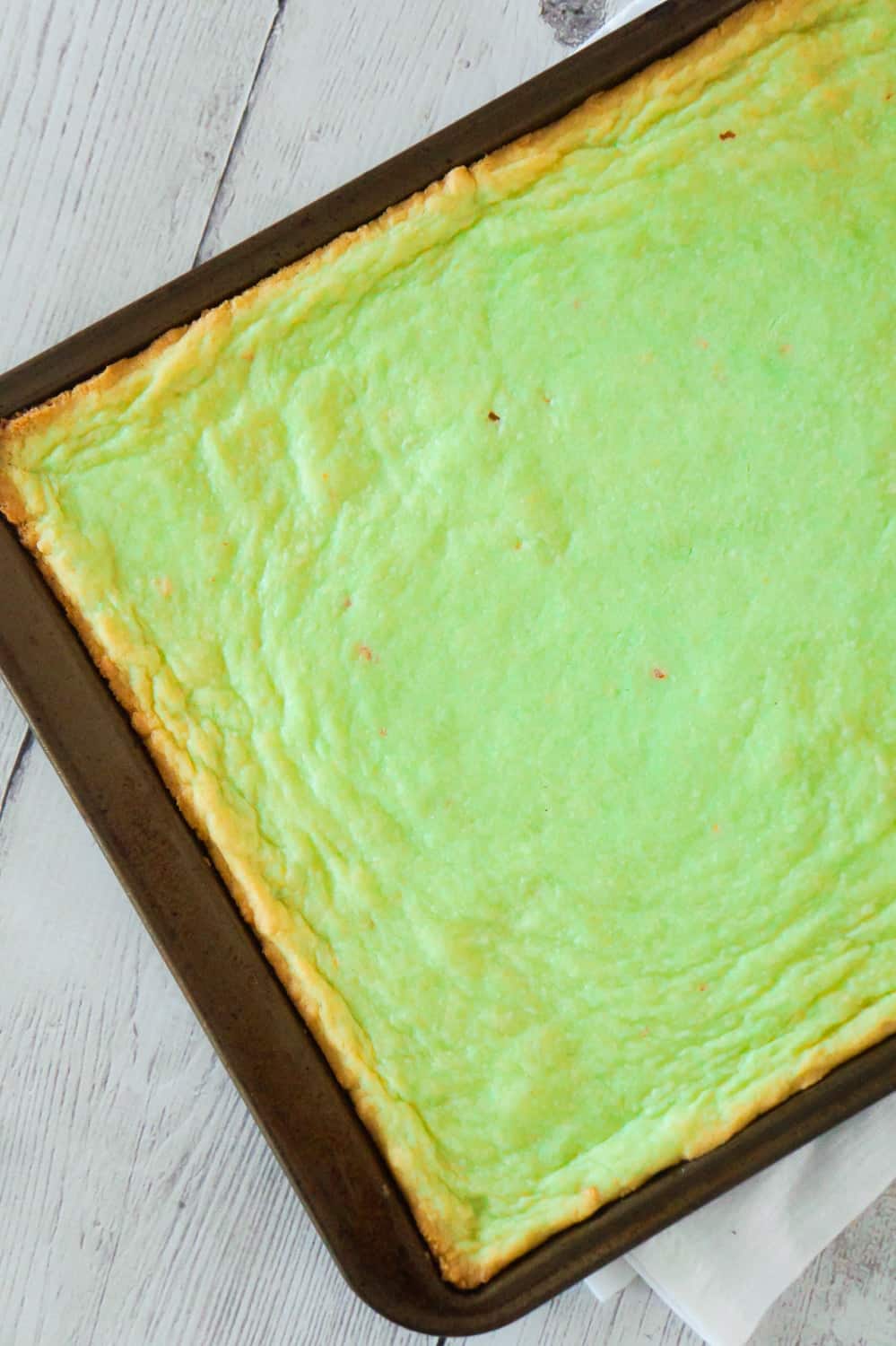 Pistachio Pudding Sugar Cookie Bars are soft, chewy and delicious. This super easy cookie bar recipe uses pistachio instant pudding mix and Betty Crocker sugar cookie mix.