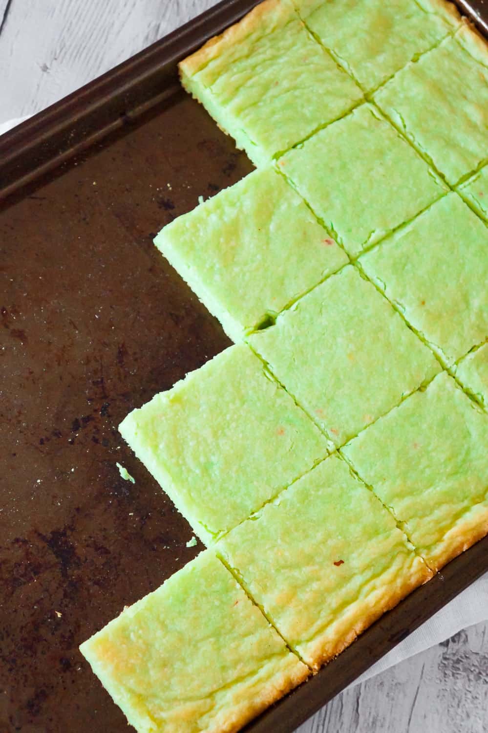 Pistachio Pudding Sugar Cookie Bars are soft, chewy and delicious. This super easy cookie bar recipe uses pistachio instant pudding mix and Betty Crocker sugar cookie mix.