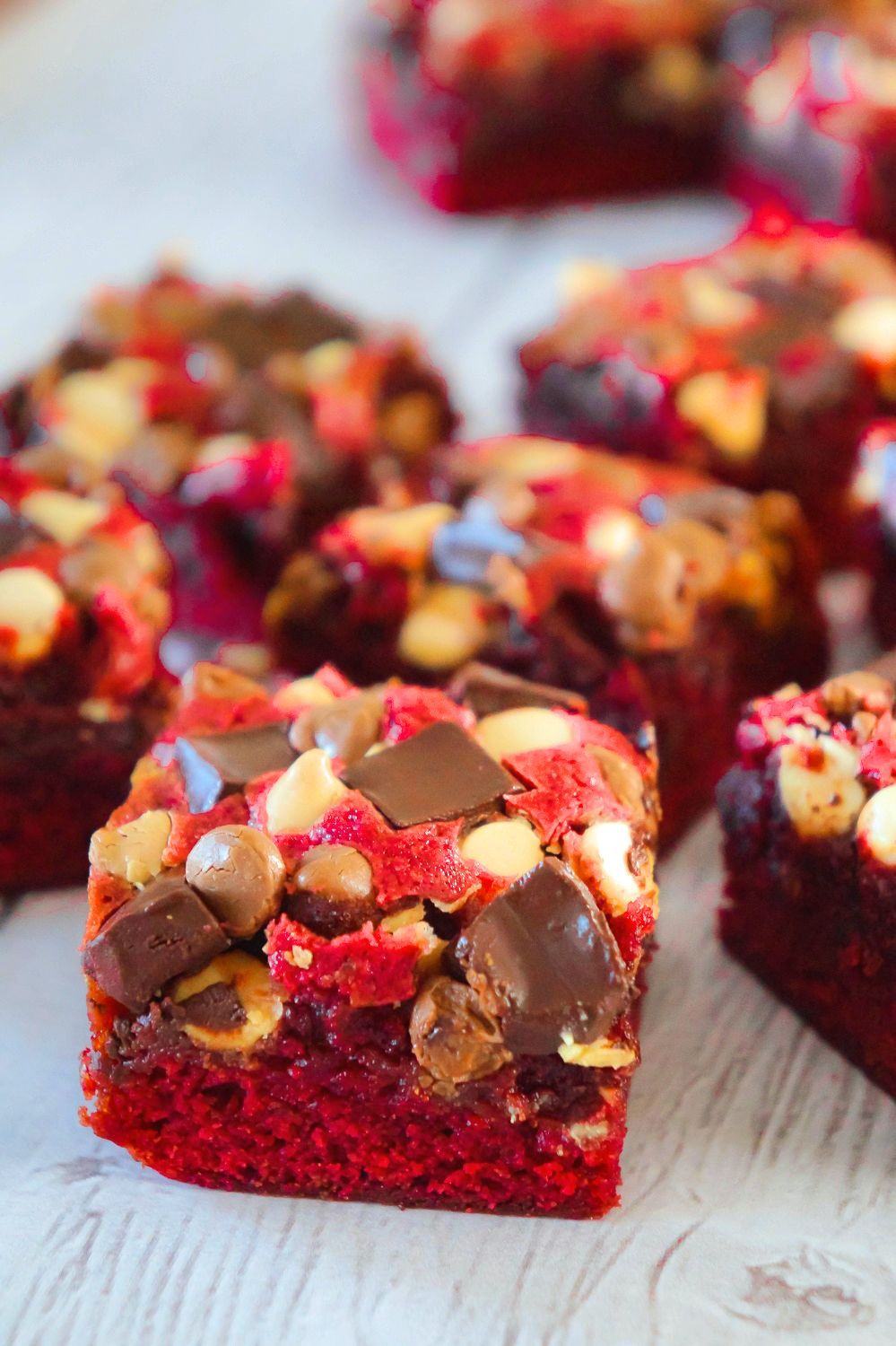 Red Velvet Brownies are delicious and chewy homemade brownies loaded with white chocolate chips, dark chocolate chunks and milk chocolate chips. These decadent red velvet treats are the perfect Valentine's Day dessert.