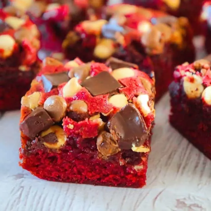 Red Velvet Brownies are delicious and chewy homemade brownies loaded with white chocolate chips, dark chocolate chunks and milk chocolate chips. These decadent red velvet treats are the perfect Valentine's Day dessert.