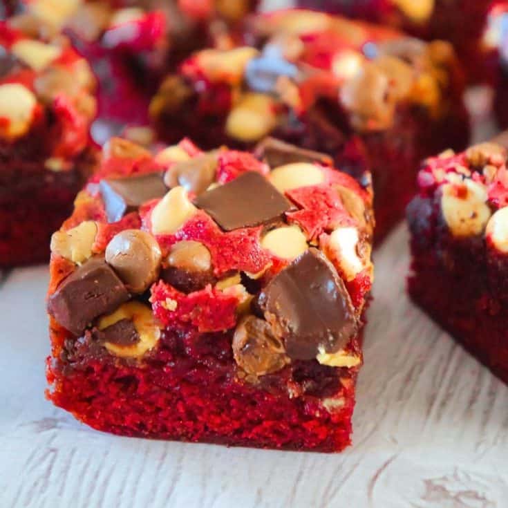 Red Velvet Brownies are delicious and chewy homemade brownies loaded with white chocolate chips, dark chocolate chunks and milk chocolate chips. These decadent red velvet treats are the perfect Valentine's Day dessert.