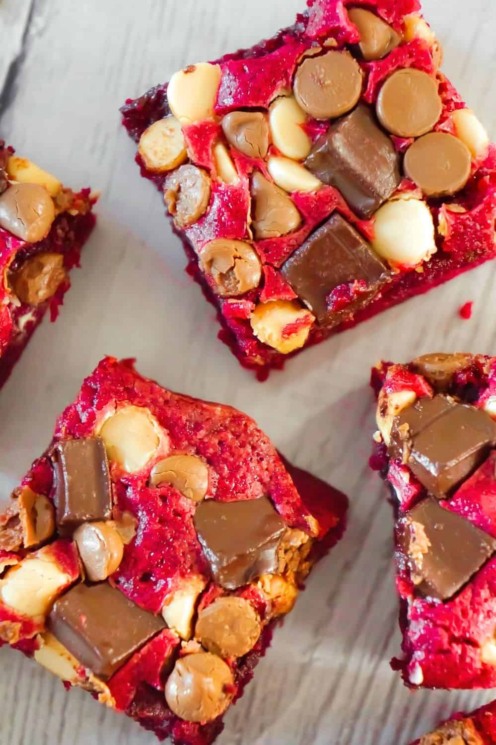 Red Velvet Brownies are delicious and chewy homemade brownies loaded with white chocolate chips, dark chocolate chunks and milk chocolate chips. These decadent red velvet treats are the perfect Valentine's Day dessert.