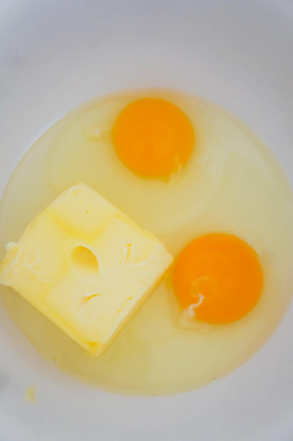 softened butter and eggs in a mixing bowl