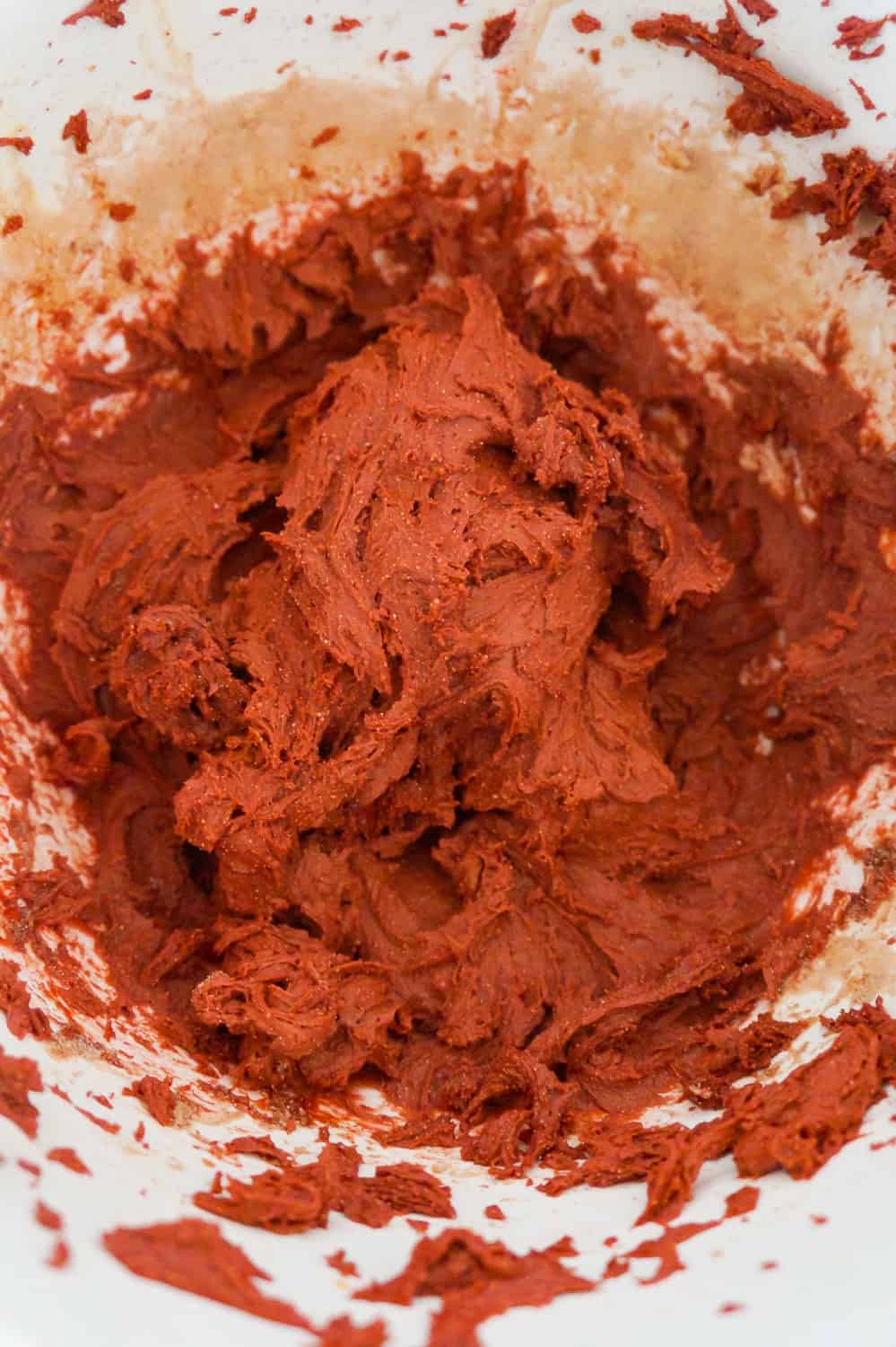 red velvet cookie dough mixture in a mixing bowl