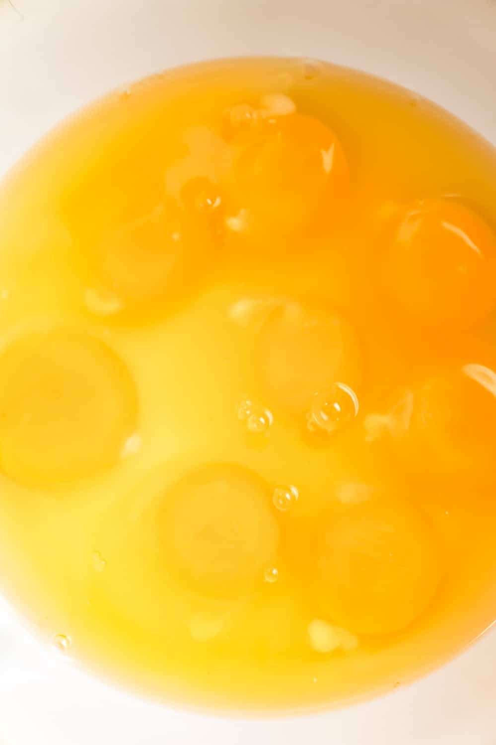 raw eggs in a mixing bowl