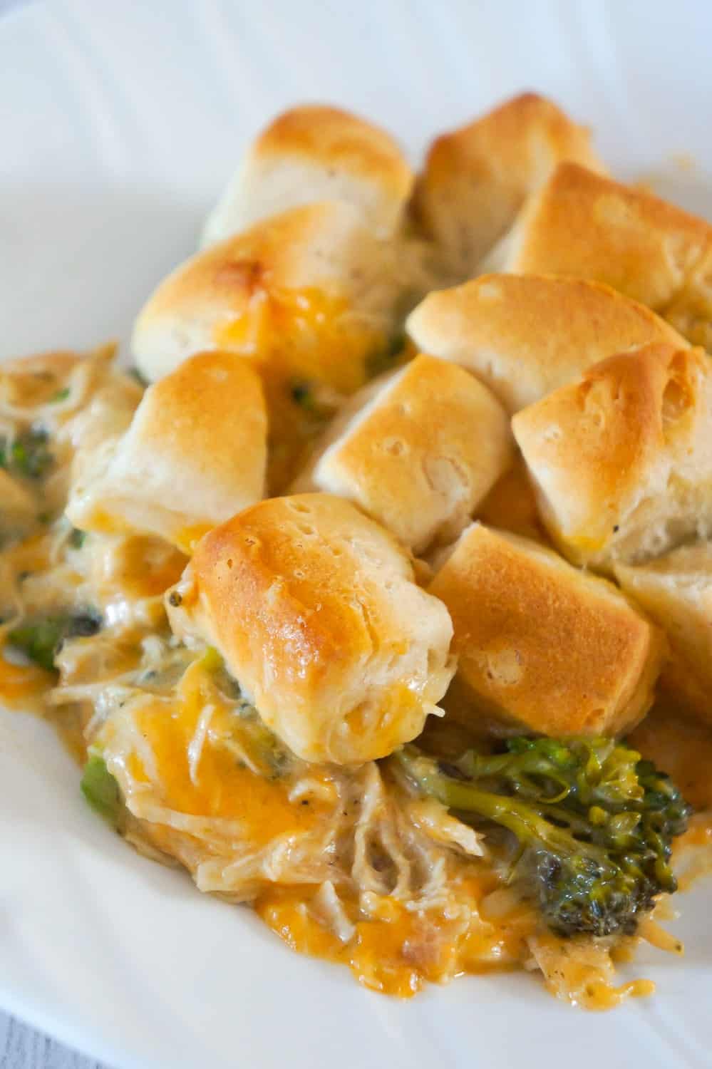 Chicken Casserole with Broccoli and Biscuits is an easy chicken dinner recipe using shredded chicken and Pillsbury biscuits. These creamy chicken casserole is loaded with broccoli and cheddar cheese.