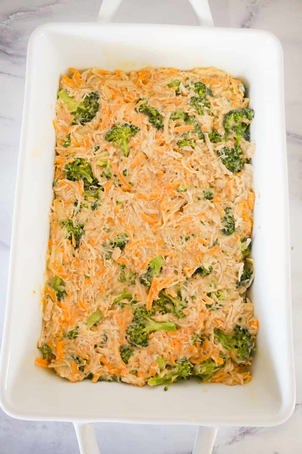 cheesy chicken and broccoli mixture in a baking dish